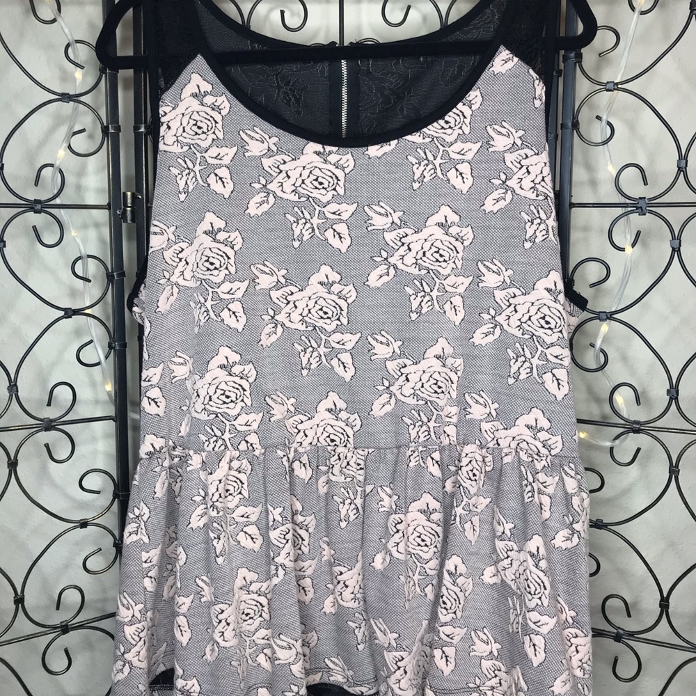 Peplum style tank with blush floral detailing